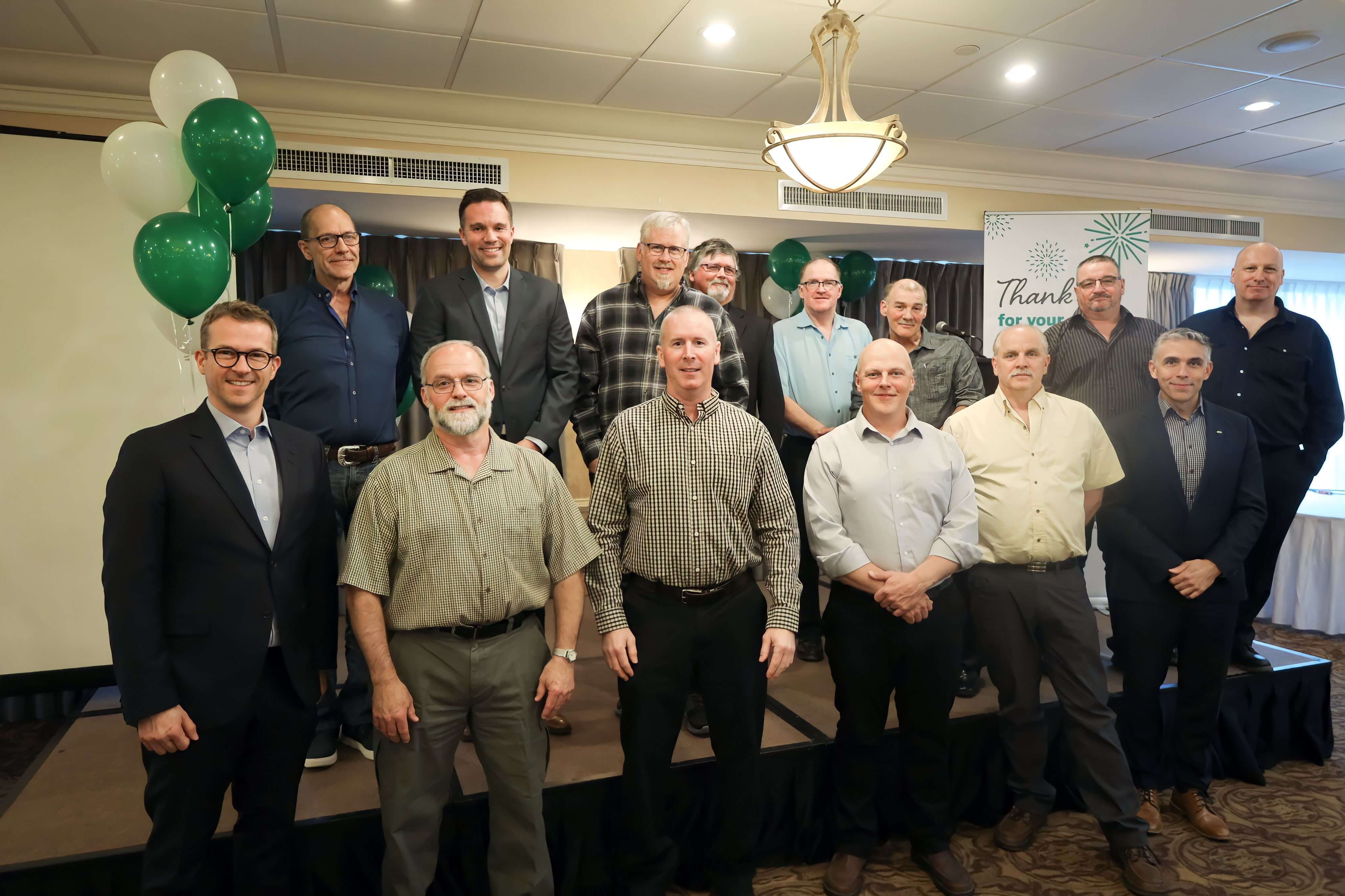 Long term employees posing together