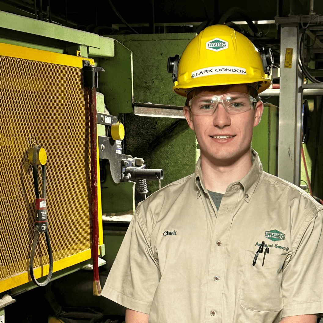Clark Condon standing in front of machinery