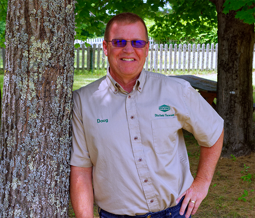 Doug Brown leaning against a tree